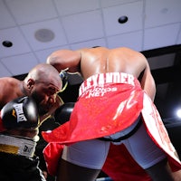 two boxers fighting in a boxing ring