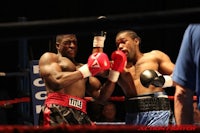 two boxers fighting in a boxing ring