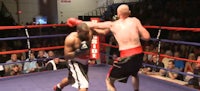 two boxers fighting in a boxing ring